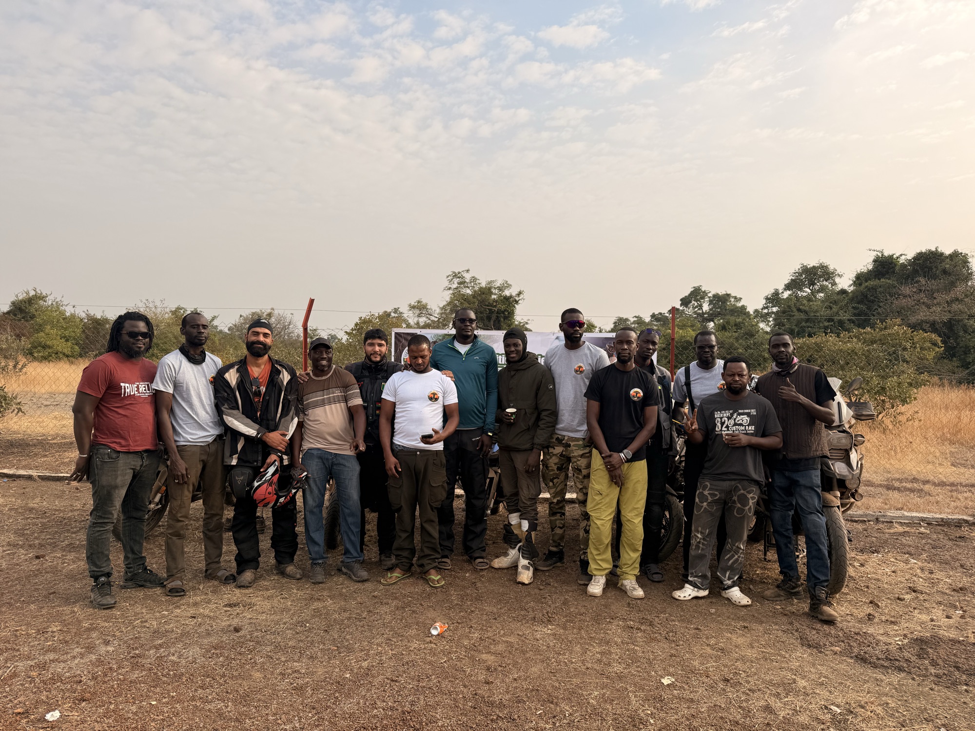 Africa Trail Trophy — adventure bikes lined at sunset, Kédougou